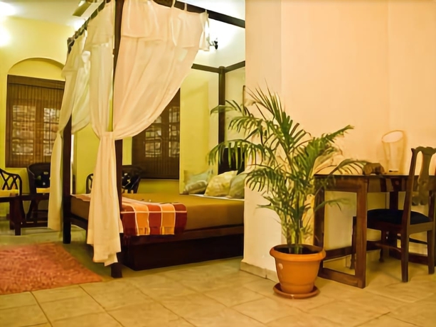 Imagen de la habitación del Casa de Huéspedes Banyan Tree Courtyard. Foto 10