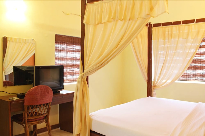 Imagen de la habitación del Casa de Huéspedes Banyan Tree Courtyard. Foto 14