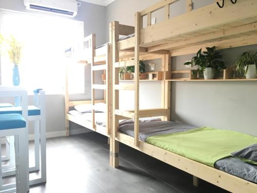 Imagen de la habitación del Casa de Huéspedes Beihai Neat International. Foto 6