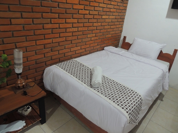 Imagen de la habitación del Casa de Huéspedes Dalem Sudarno Syariah by Ndalem Beong. Foto 3