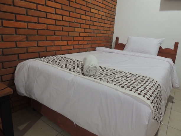 Imagen de la habitación del Casa de Huéspedes Dalem Sudarno Syariah by Ndalem Beong. Foto 4