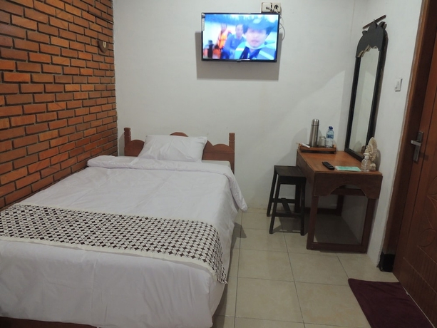 Imagen de la habitación del Casa de Huéspedes Dalem Sudarno Syariah by Ndalem Beong. Foto 7