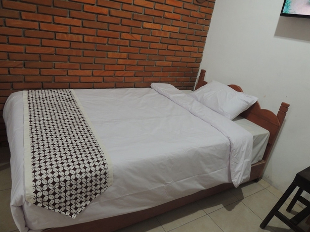 Imagen de la habitación del Casa de Huéspedes Dalem Sudarno Syariah by Ndalem Beong. Foto 9