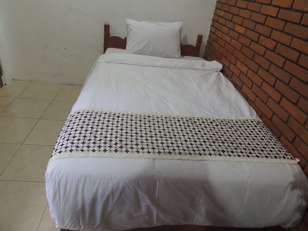 Imagen de la habitación del Casa de Huéspedes Dalem Sudarno Syariah by Ndalem Beong. Foto 10