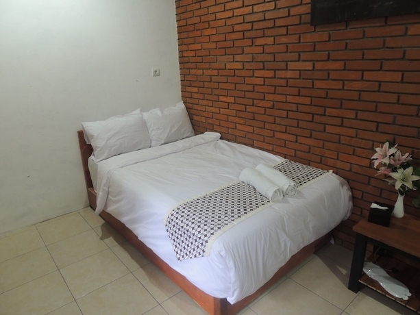 Imagen de la habitación del Casa de Huéspedes Dalem Sudarno Syariah by Ndalem Beong. Foto 11