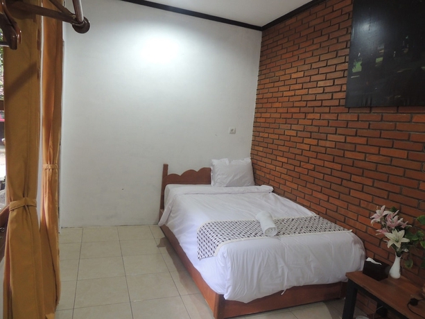 Imagen de la habitación del Casa de Huéspedes Dalem Sudarno Syariah by Ndalem Beong. Foto 12