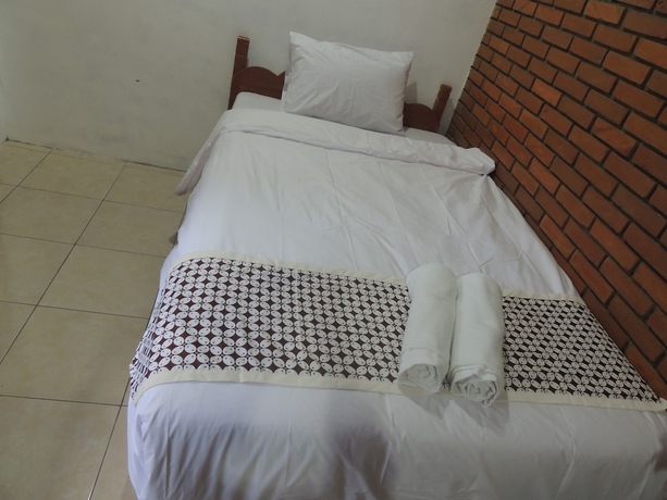 Imagen de la habitación del Casa de Huéspedes Dalem Sudarno Syariah by Ndalem Beong. Foto 13