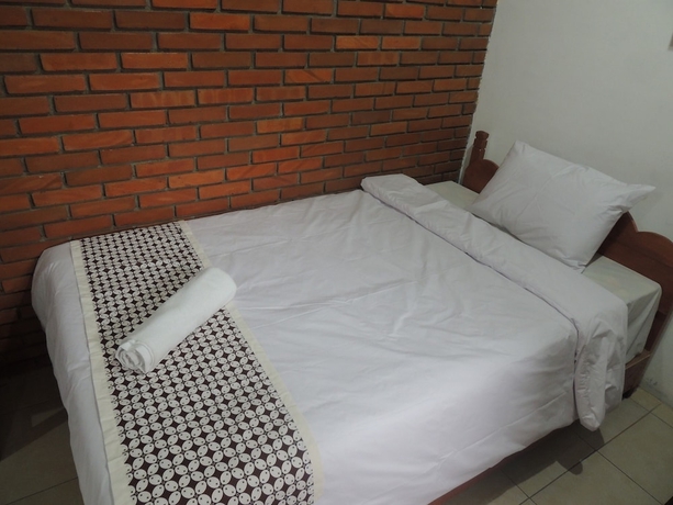 Imagen de la habitación del Casa de Huéspedes Dalem Sudarno Syariah by Ndalem Beong. Foto 15