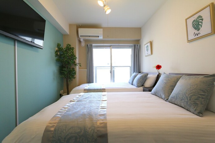 Imagen de la habitación del Casa de Huéspedes Elizabeth Garden Shinsaibashi. Foto 16