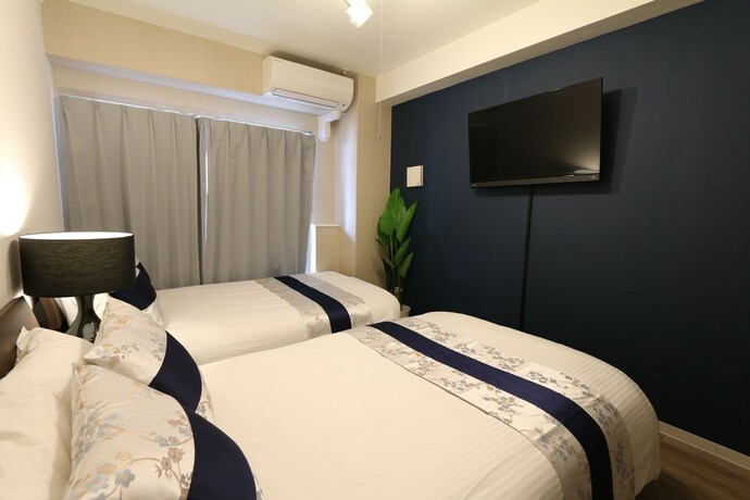 Imagen de la habitación del Casa de Huéspedes Elizabeth Garden Shinsaibashi. Foto 20