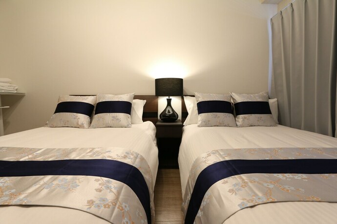 Imagen de la habitación del Casa de Huéspedes Elizabeth Garden Shinsaibashi. Foto 21