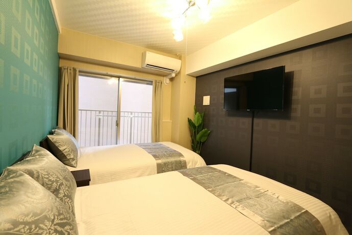 Imagen de la habitación del Casa de Huéspedes Elizabeth Garden Shinsaibashi. Foto 23