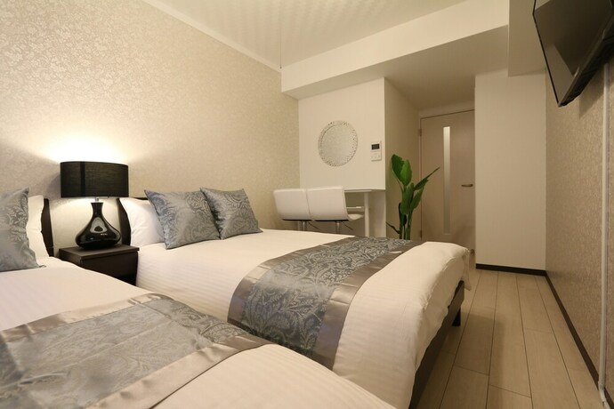 Imagen de la habitación del Casa de Huéspedes Elizabeth Garden Shinsaibashi. Foto 32