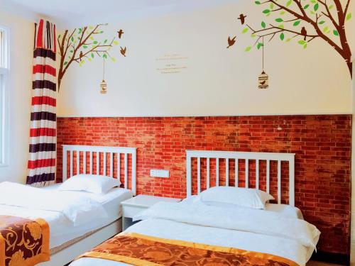 Imagen de la habitación del Casa de Huéspedes Fenghuang Xianhou Time Boutique. Foto 6