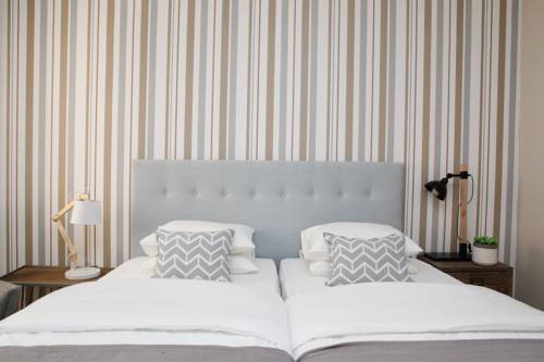 Imagen de la habitación del Casa de Huéspedes Flores Guest House. Foto 5