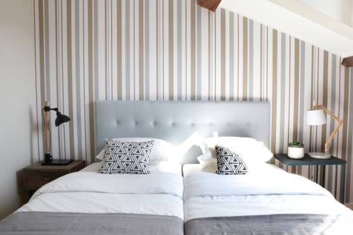 Imagen de la habitación del Casa de Huéspedes Flores Guest House. Foto 10