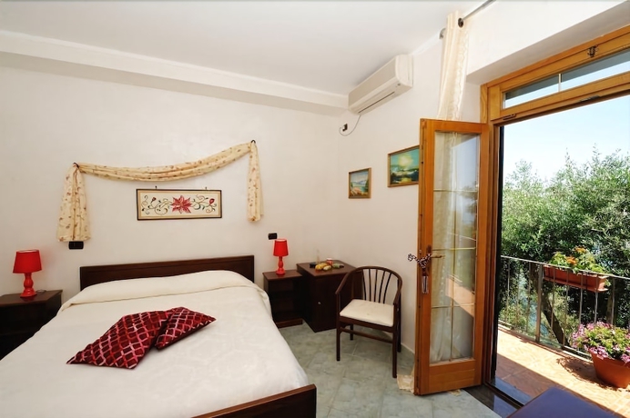 Imagen de la habitación del Casa de Huéspedes Holiday House Le Palme. Foto 10