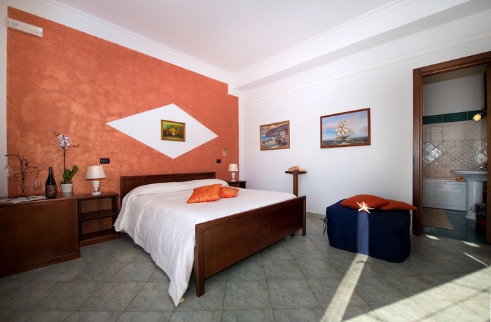 Imagen de la habitación del Casa de Huéspedes Holiday House Le Palme. Foto 12