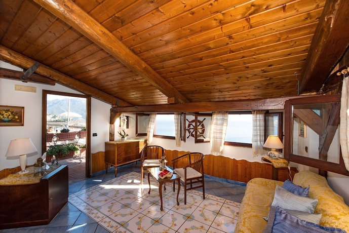 Imagen de la habitación del Casa de Huéspedes Holiday House Le Palme. Foto 14