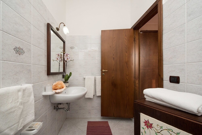 Imagen de la habitación del Casa de Huéspedes Holiday House Le Palme. Foto 16