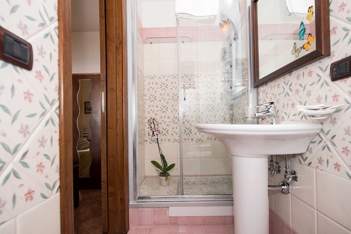 Imagen de la habitación del Casa de Huéspedes Holiday House Le Palme. Foto 17