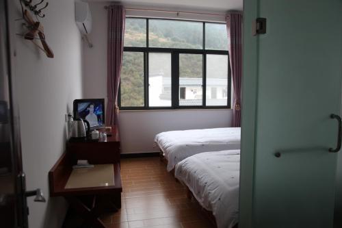 Imagen de la habitación del Casa de Huéspedes Huang Mountain Yiyun Buffet Family. Foto 3