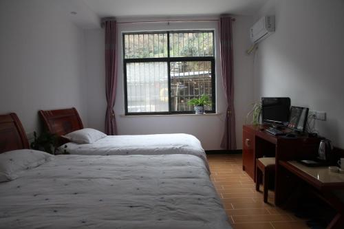 Imagen de la habitación del Casa de Huéspedes Huang Mountain Yiyun Buffet Family. Foto 5