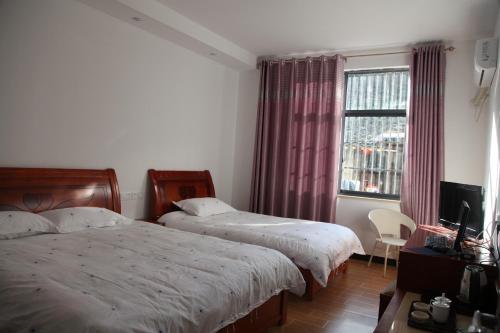 Imagen de la habitación del Casa de Huéspedes Huang Mountain Yiyun Buffet Family. Foto 7