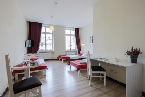 Imagen de la habitación del Casa de Huéspedes Kamienica Pod Aniołami. Foto 7