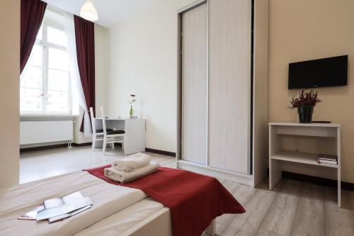 Imagen de la habitación del Casa de Huéspedes Kamienica Pod Aniołami. Foto 11