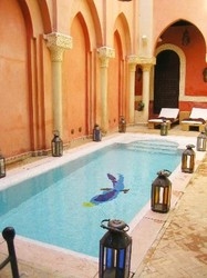 Imagen de la piscina del Casa de Huéspedes Le Perroquet Bleu. Foto 12