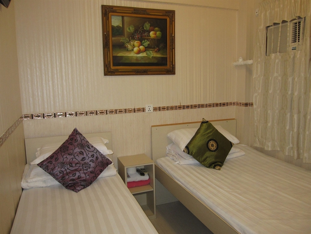 Imagen de la habitación del Casa de Huéspedes Lily Garden Guest House. Foto 5