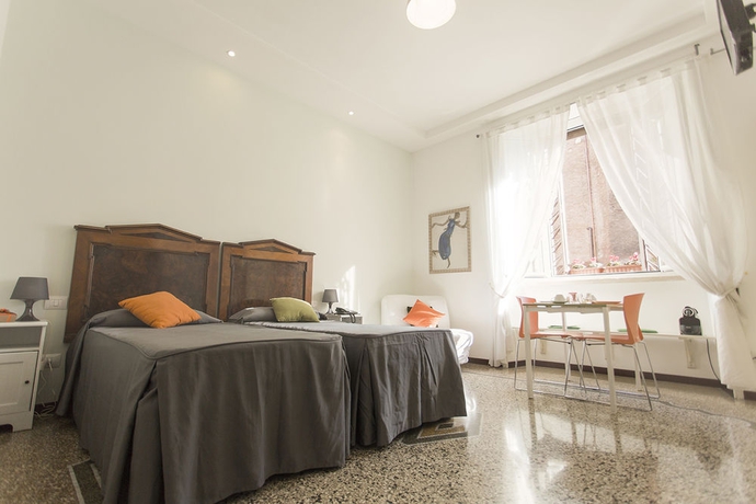 Imagen de la habitación del Casa de Huéspedes Maison Colosseo. Foto 3