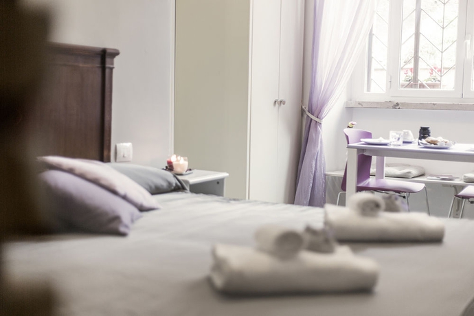 Imagen de la habitación del Casa de Huéspedes Maison Colosseo. Foto 7