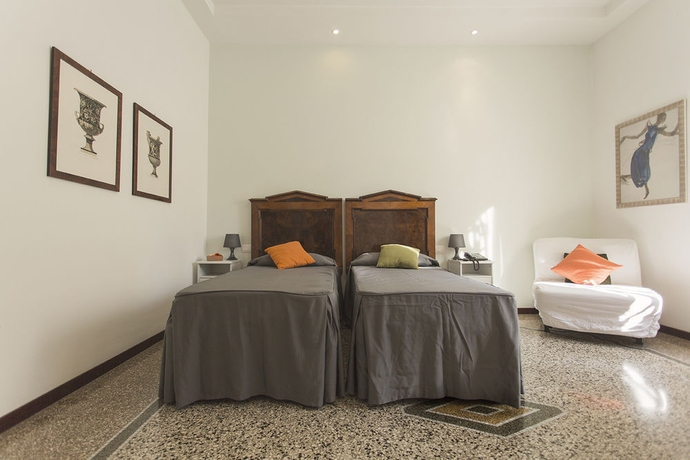 Imagen de la habitación del Casa de Huéspedes Maison Colosseo. Foto 8