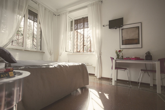 Imagen de la habitación del Casa de Huéspedes Maison Colosseo. Foto 9