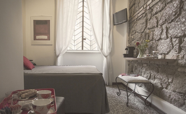 Imagen de la habitación del Casa de Huéspedes Maison Colosseo. Foto 11