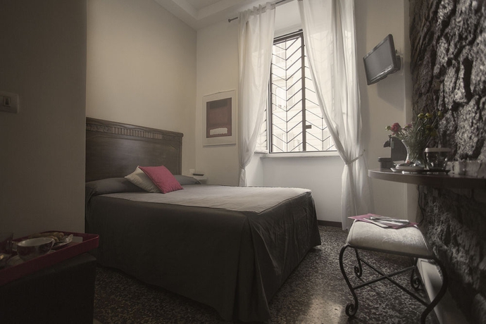 Imagen de la habitación del Casa de Huéspedes Maison Colosseo. Foto 12