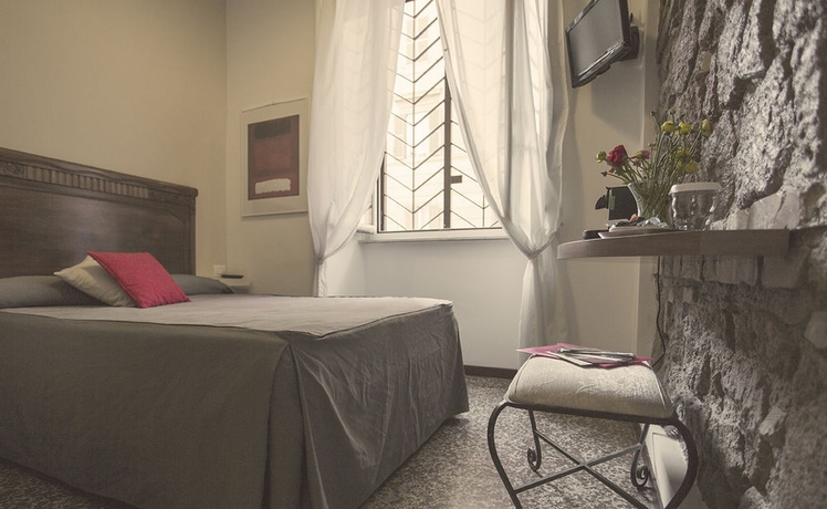 Imagen de la habitación del Casa de Huéspedes Maison Colosseo. Foto 15