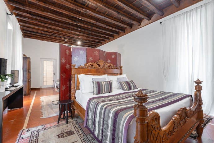 Imagen de la habitación del Casa de Huéspedes Maison Evelina. Foto 15