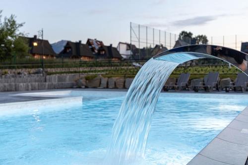 Imagen de la piscina del Casa de Huéspedes Malućko Chata. Foto 17