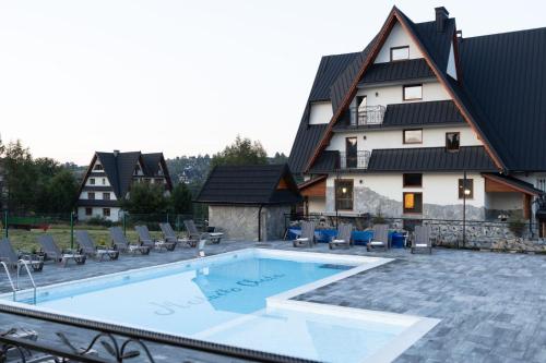 Imagen de la piscina del Casa de Huéspedes Malućko Chata. Foto 18