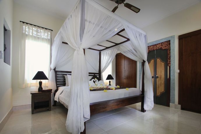 Imagen de la habitación del Casa de Huéspedes Mawa House By Pramana Villas. Foto 2