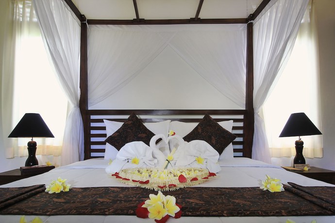 Imagen de la habitación del Casa de Huéspedes Mawa House By Pramana Villas. Foto 8