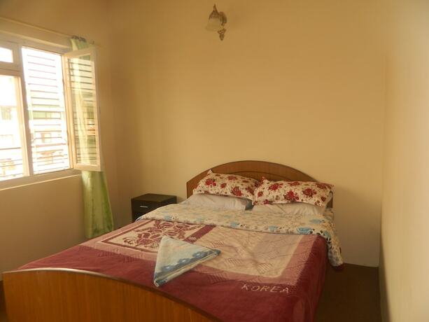 Imagen de la habitación del Casa de Huéspedes Om Tara Guest House. Foto 28