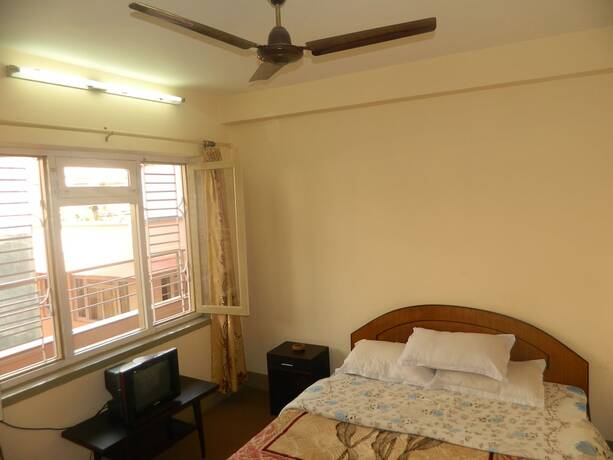 Imagen de la habitación del Casa de Huéspedes Om Tara Guest House. Foto 29