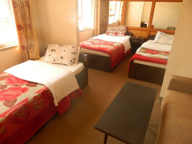 Imagen de la habitación del Casa de Huéspedes Om Tara Guest House. Foto 30