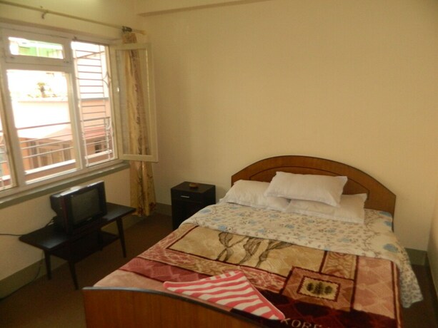 Imagen de la habitación del Casa de Huéspedes Om Tara Guest House. Foto 31