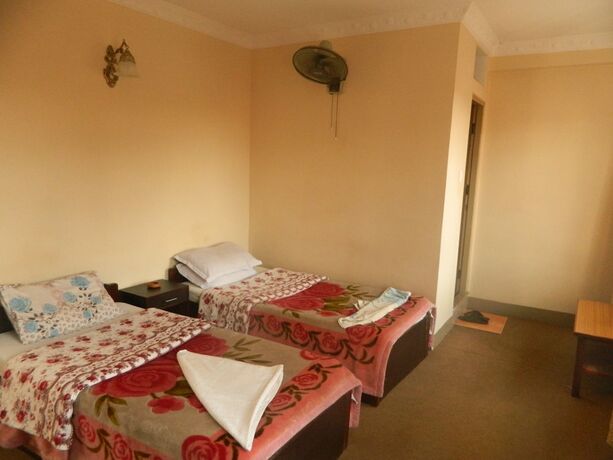 Imagen de la habitación del Casa de Huéspedes Om Tara Guest House. Foto 38
