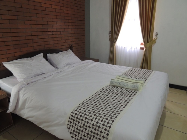 Imagen de la habitación del Casa de Huéspedes Omah Mardi Syariah by Ndalem Beong. Foto 3